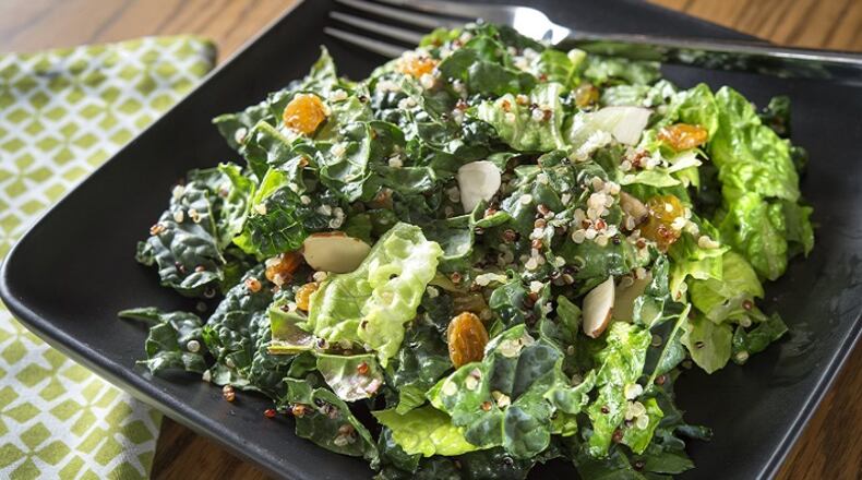 Quinoa Kale Salad With Raisins and Almonds can be dressed in advanced to allow time for the kale to soften and flavors to meld. (Tammy Ljungblad/Kansas City Star/TNS)