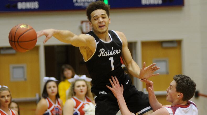 WSU’s Justin Mitchell (top) goes for a loose ball against Detroit. Wright State defeated host Detroit Mercy 85-72 on Dec. 31. MARC PENDLETON / STAFF