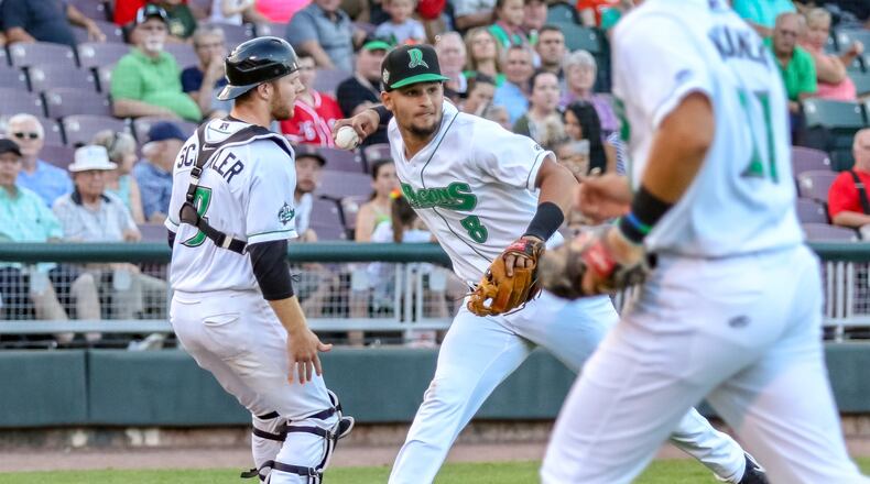 Dayton Dragons third baseman Juan Martinez fields a bunt during their game against the Wisconsin Timber Rattlers in 2019. Martinez homered Sunday in the Dragons' loss to South Bend. CONTRIBUTED PHOTO BY MICHAEL COOPER