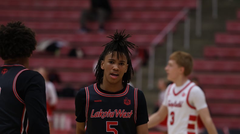 Lakota West sophomore Andre Richardson walks down the court during a timeout against Fairfield on Tuesday night at Fairfield Arena. ELIJAH COOK / CONTRIBUTER