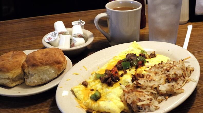 The Mel-O-Dee Omelette with hashbrowns and biscuits and coffee. Bill Lackey/Staff