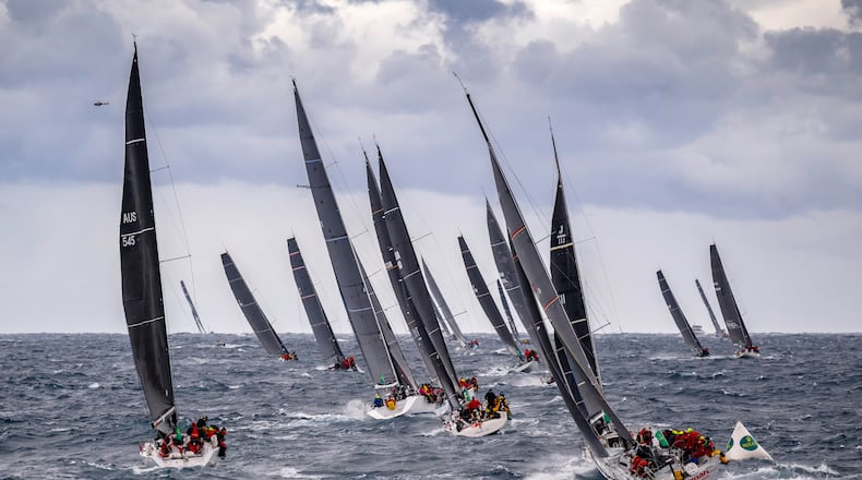 In this photo provided by the Cruising Yacht Club of Australia, competitors make a start in the Sydney Hobart yacht race in Sydney, Friday, Dec. 26, 2025. (Kurt Arrigo/CYCA via AP)