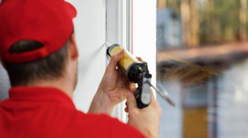 Sealing windows and doors with caulk or weather stripping offers the first line of defense against air loss. (Dreamstime)