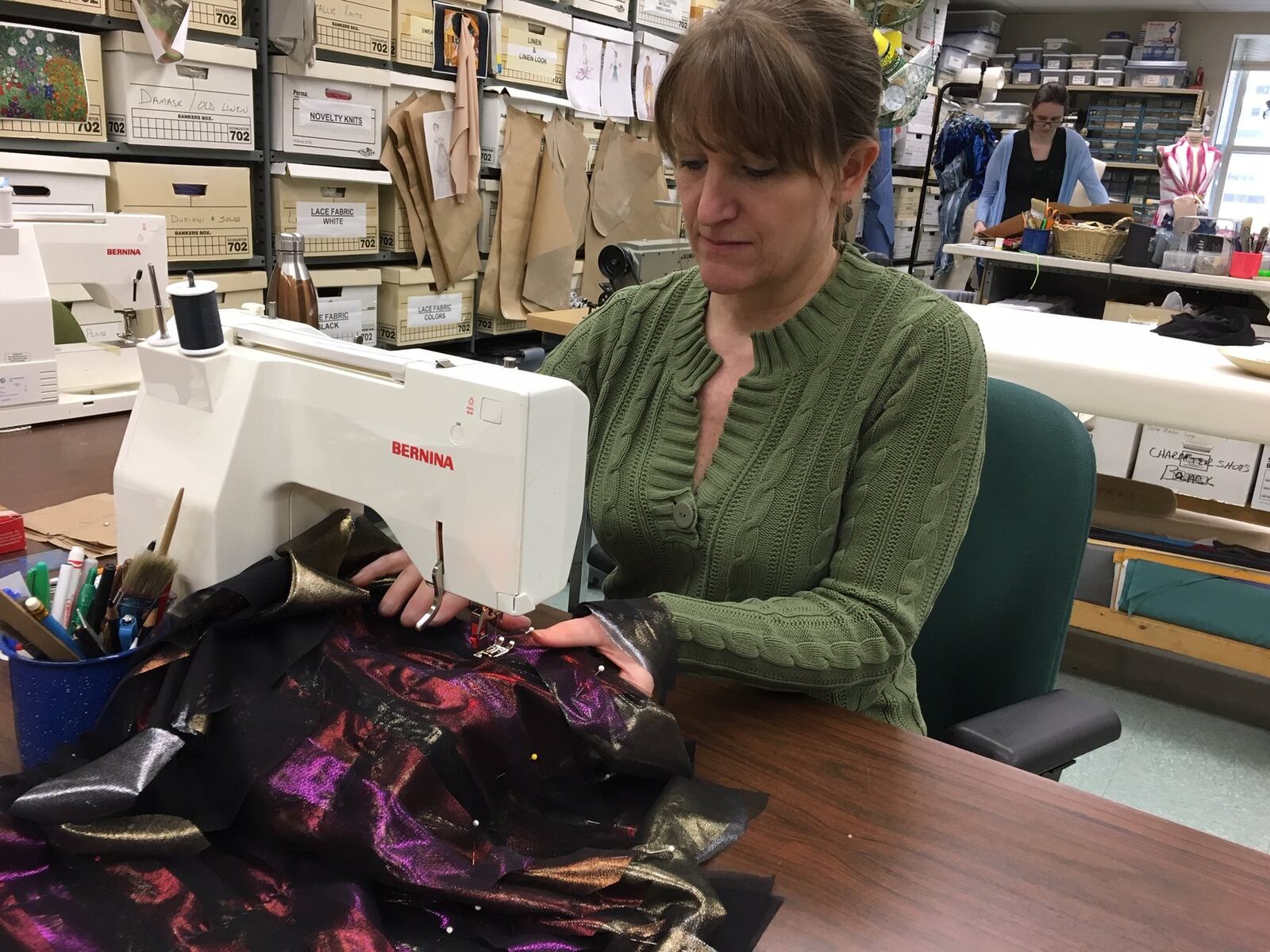 Lyn Baudendistel, wardrobe supervisor for the Dayton Ballet, works on a sleeve for the character of Cinereous, the Great Vulture. MEREDITH MOSS/STAFF