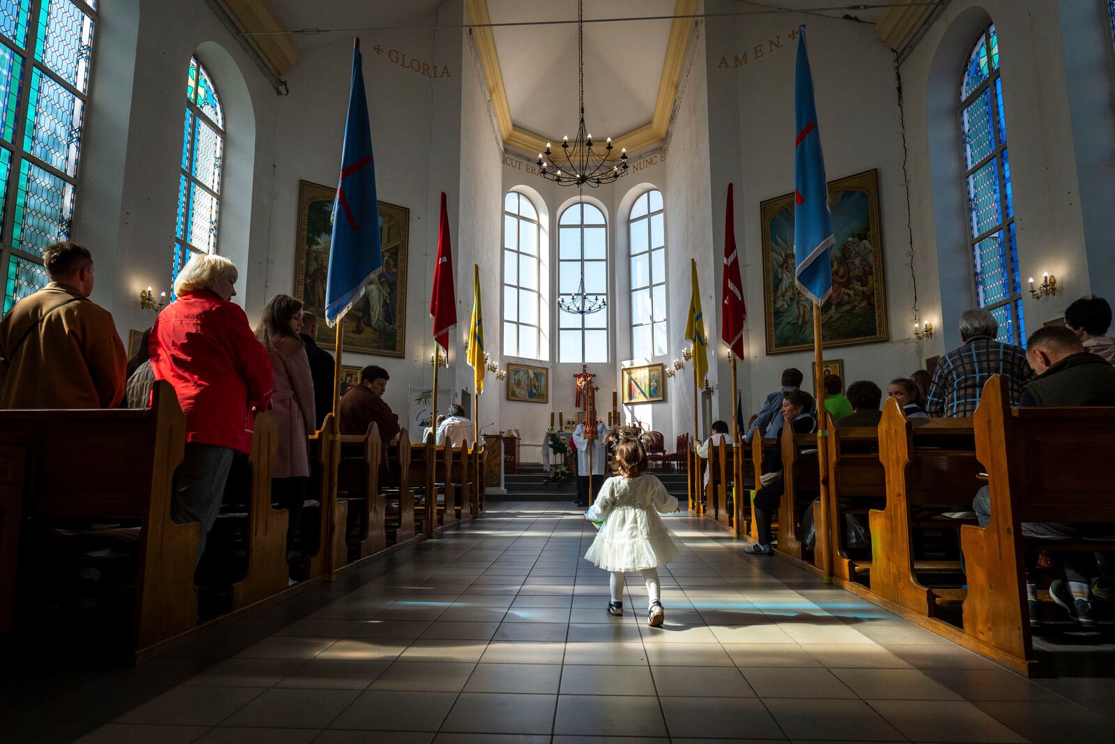 Ukrainian Roman Catholic believers celebrate Easter in a cathedral in Kropyvnytskyi, Ukraine, Sunday, April 20, 2025. (AP Photo/Dan Bashakov)