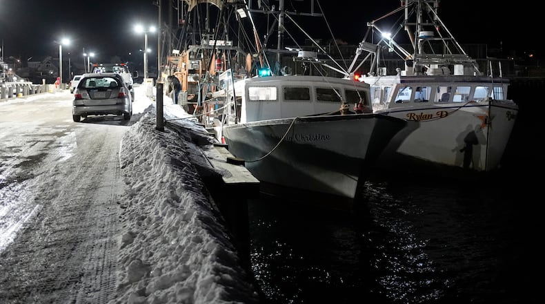 Fishing boats are tied up in Gloucester, Mass., the home port of a vessel that that went missing at sea with seven people aboard, Friday, Jan. 30, 2026. (AP Photo/Robert F. Bukaty)