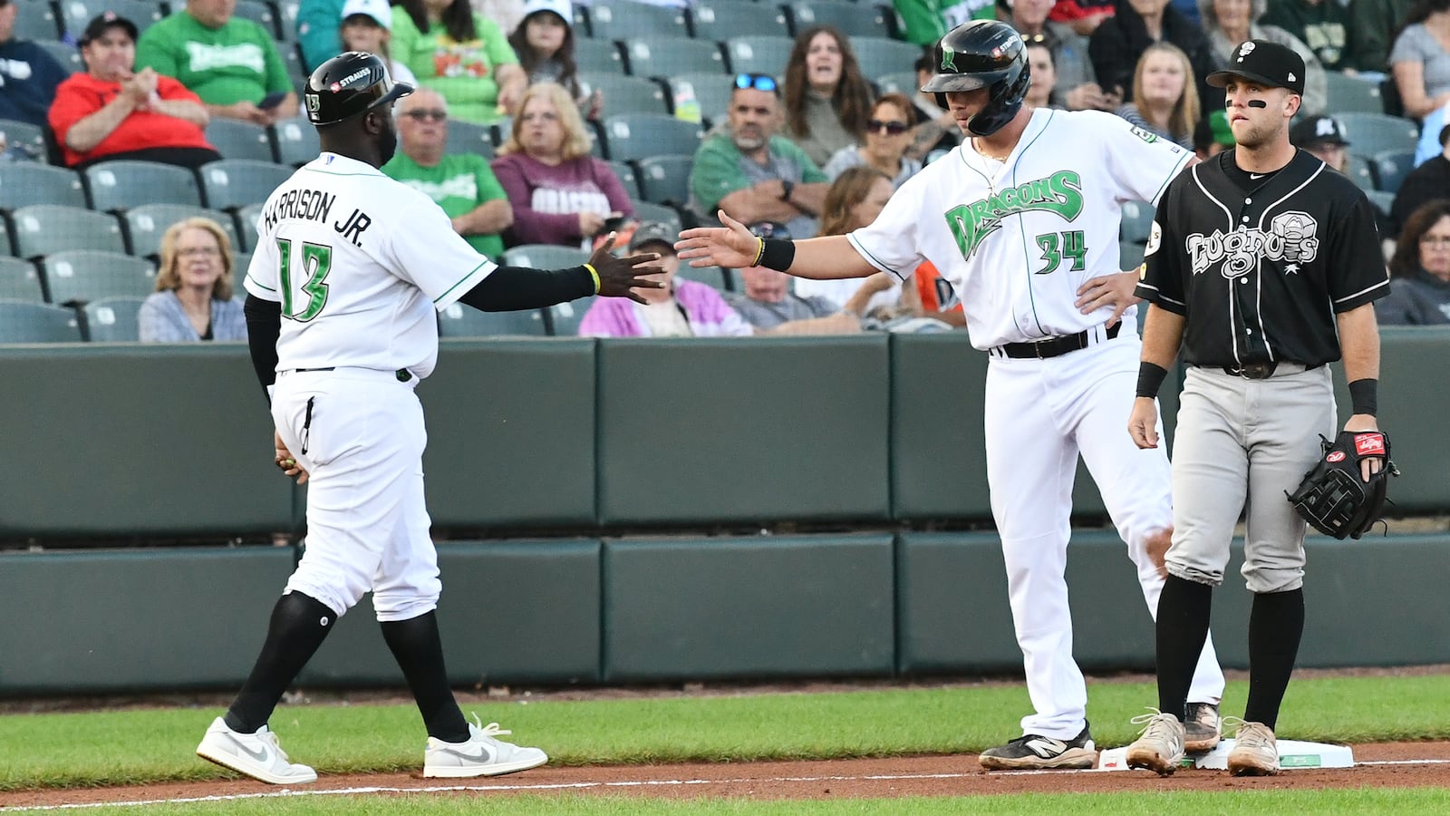Dayton's Carter Graham ends up at third base on a passed ball in the first inning Thursday night at Day Air Ballpark. JEFF GILBERT/CONTRIBUTED