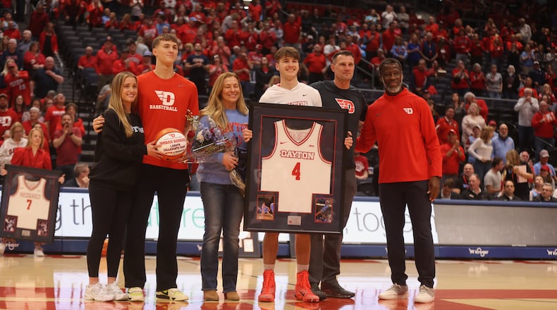 Dayton's Jordan Derkack is honored with his family on Senior Night before a game against Virginia Commonwealth on Friday, March 6, 2026, at UD Arena. Aiden Derkack, Jordan's brother, is second from left. David Jablonski/Staffnski/Staff