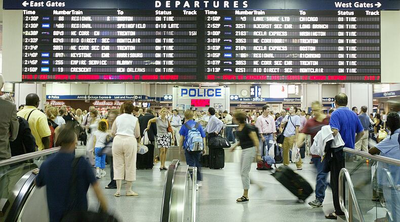 NEW YORK - JULY 2: Commuters and travelers wait for their trains in Penn Station July 2, 2004 in New York City. AAA estimates that 39.4 millions Americans will travel 50 miles or more from home this July 4 holiday weekend. (Photo by Mario Tama/Getty Images)
