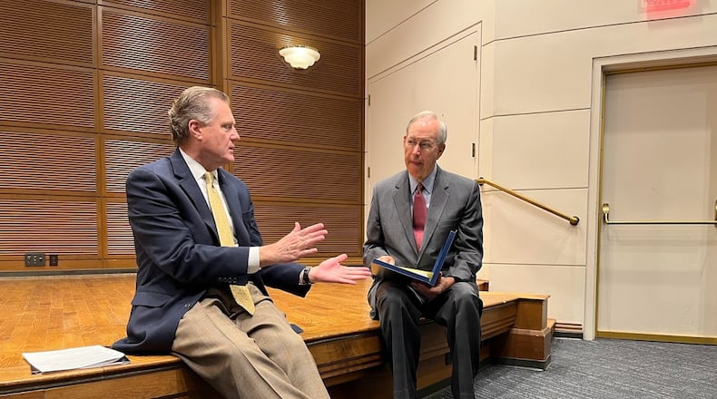 U.S. Rep. Mike Turner, R-Dayton, left, and former Ohio Gov. Bob Taft, a faculty member at the University of Dayton, speaking shortly before a press conference Monday at UD. THOMAS GNAU/STAFF