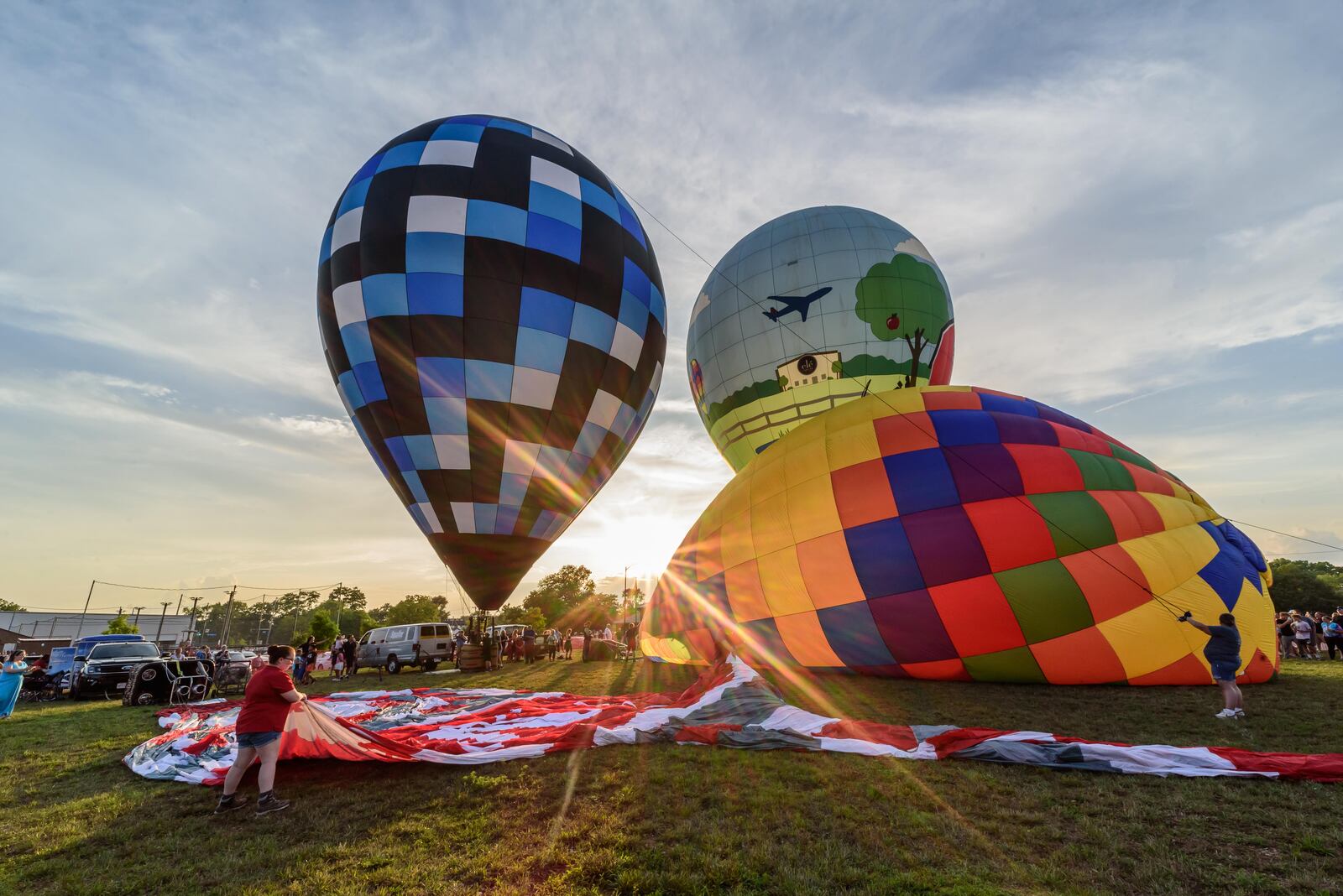 The City of West Carrollton hosted a hot air balloon glow by the Askren Air Balloon Team with food trucks, beer and a concert featuring The Fries Band on Friday, July 12, 2024 at 1 S. Elm St. TOM GILLIAM / CONTRIBUTING PHOTOGRAPHER