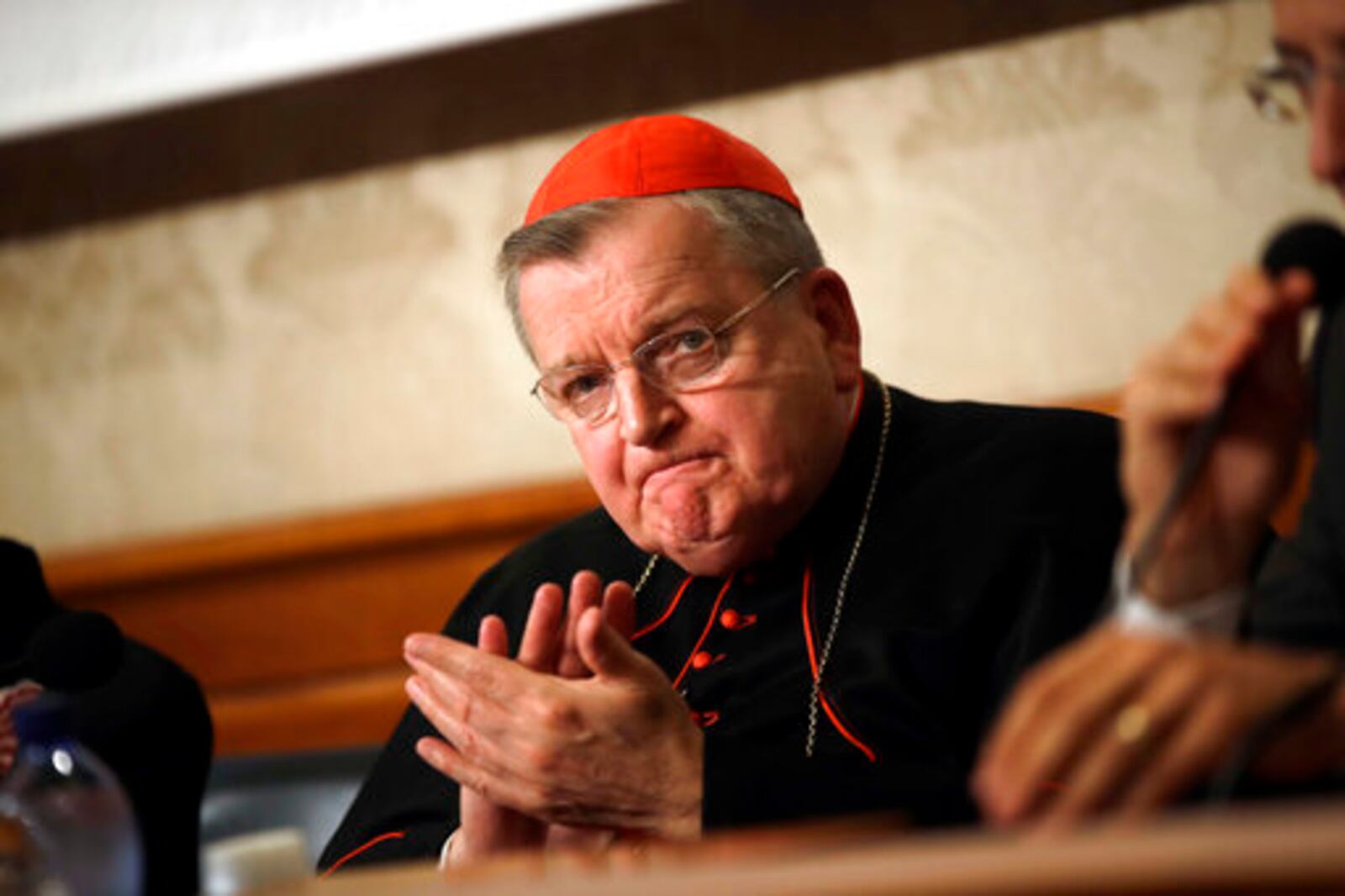 FILE - Cardinal Raymond Burke applauds during a news conference on the first anniversary of the death of Cardinal Carlo Caffarra, at the Italian Senate, in Rome, Thursday, Sept. 6, 2018. (AP Photo/Alessandra Tarantino, file)
