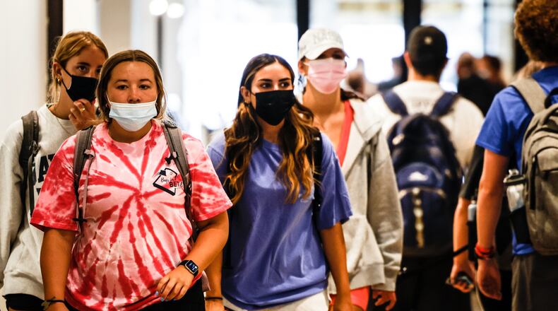 UD students walk to class Tuesday Sept. 14, 2021, at the Hub in the Dayton Arcade. Jim Noelker/Staff