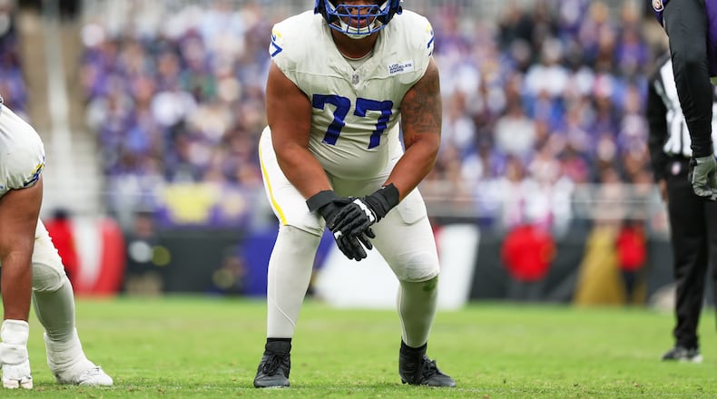 FILE - Los Angeles Rams offensive tackle Alaric Jackson (77) gets in position during the first half of an NFL football game against the Baltimore Ravens, Oct. 12, 2025, in Baltimore. (AP Photo/Terrance Williams, File)