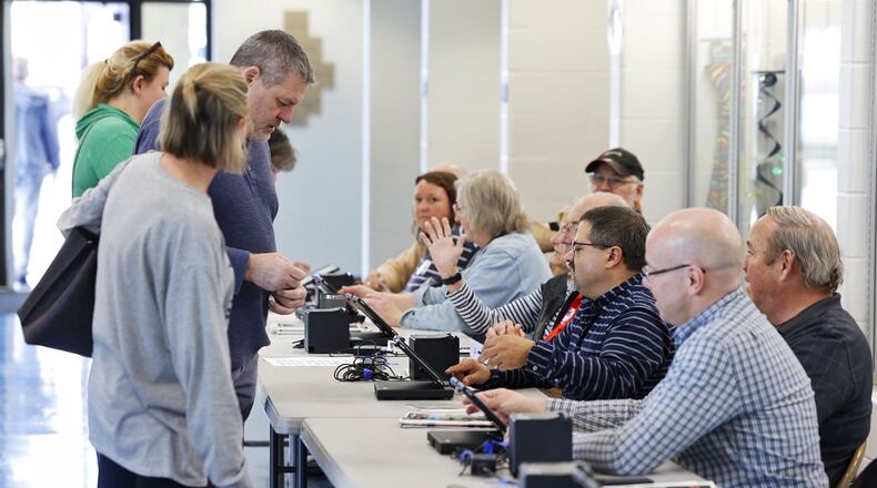 Poll workers help voters Tuesday, Nov. 8, 2022 at Edgewood Middle School. NICK GRAHAM/STAFF