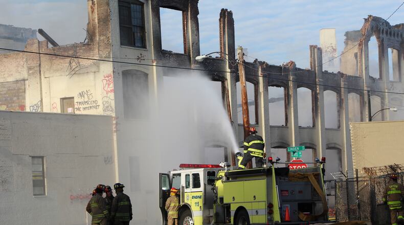 Dayton firefighters on Nov. 10 had to put out a massive fire at the Hewitt Soap Co. factory in East Dayton. CORNELIUS FROLIK / STAFF