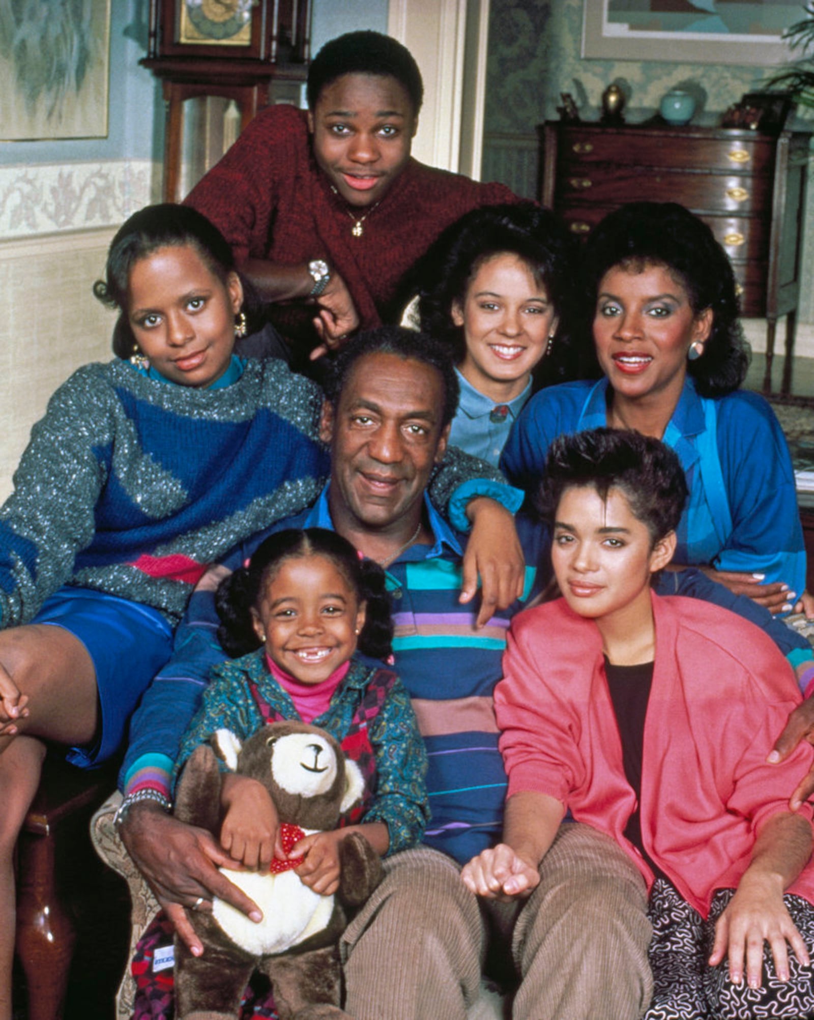 THE COSBY SHOW -- Pictured: (clockwise from top) Malcolm-Jamal Warner as Theodore 'Theo' Huxtable, Sabrina Le Beauf as Sondra Huxtable Tibideaux, Phylicia Rashad as Clair Hanks Huxtable, Lisa Bonet as Denise Huxtable, Bill Cosby as Dr. Heathcliff 'Cliff' Huxtable, Keshia Knight Pulliam as Rudy Huxtable, Tempestt Bledsoe as Vanessa Huxtable -- (Photo by: NBC)