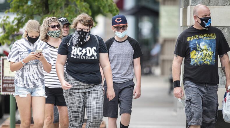 Most shoppers at The Greene in Greene County were either carrying masks or wearing mask Thursday afternoon July 23, 2020. Thursday at 6p.m. Gov. Mike Dewine issued a mask mandate for all of Ohio. JIM NOELKER/STAFF