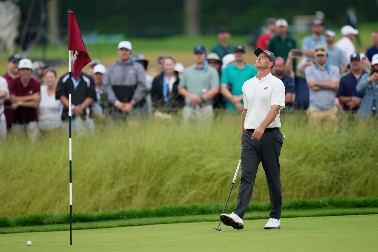 Adam Scott, of Australia, reacts after missing a putt on the 14th hole during the final round of the U.S. Open golf tournament at Oakmont Country Club Sunday, June 15, 2025, in Oakmont, Pa. (AP Photo/Seth Wenig)