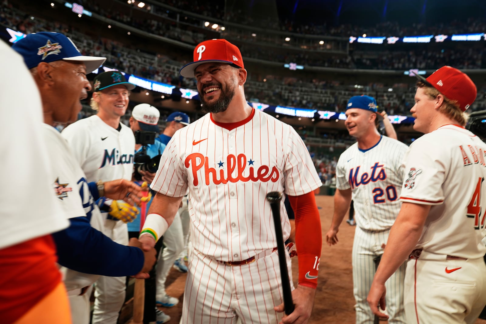Philadelphia Phillies Kyle Schwarber celebrates after winning the tiebreaker at the MLB baseball All-Star game between the American League and National League, Tuesday, July 15, 2025, in Atlanta. (AP Photo/Brynn Anderson)