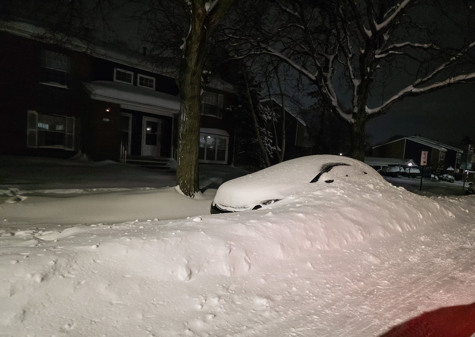 Cars are covered with snow along roads late on Sunday, January 25, 2026, in Middletown. NICK GRAHAM / STAFF