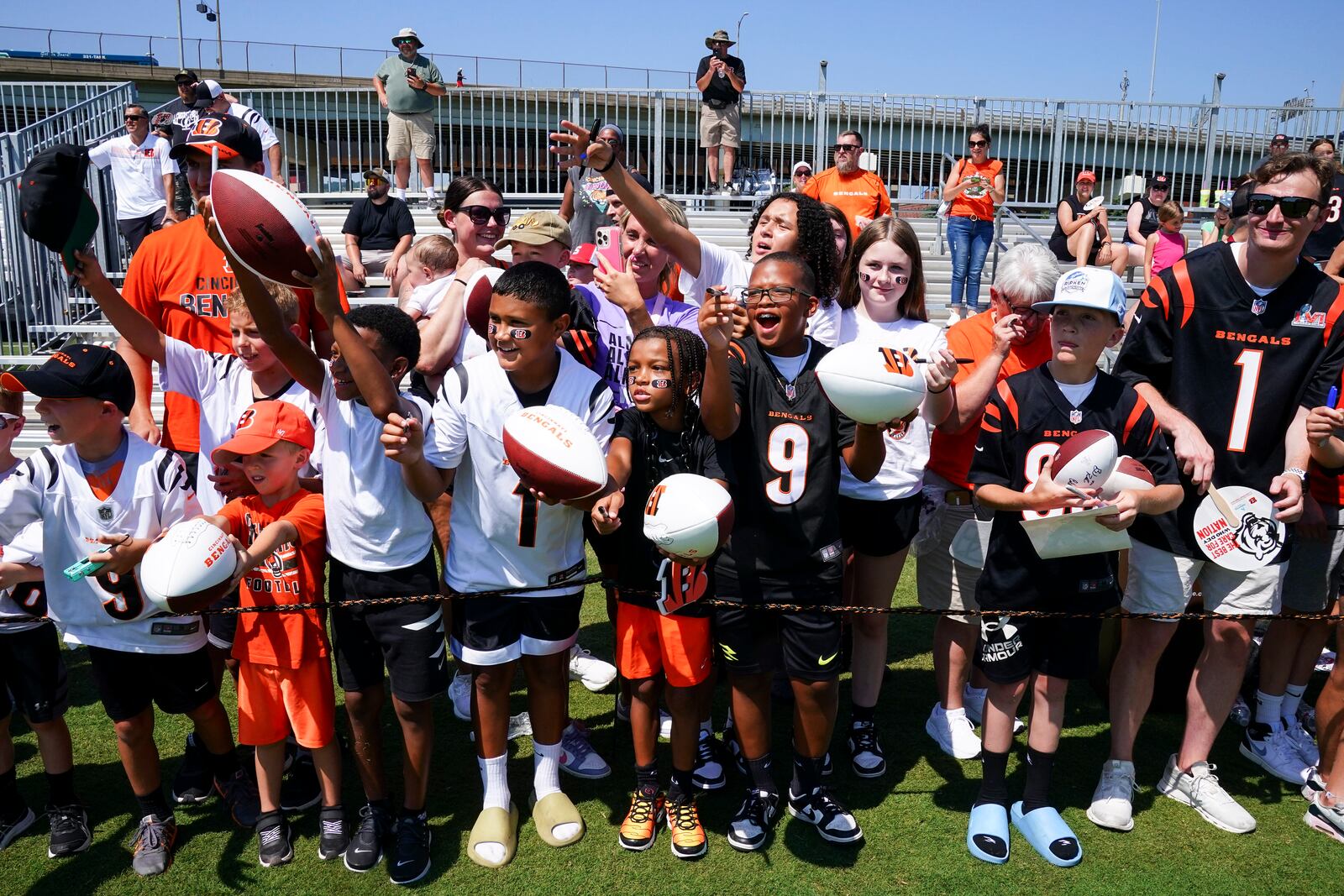 Cincinnati Bengals fans react during practice at the team's NFL football training camp, Wednesday, July 23, 2025, in Cincinnati. (AP Photo/Jeff Dean)