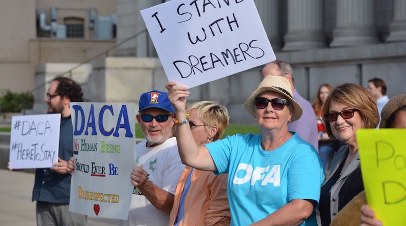 A group of supporters of the Deferred Action for Childhood Arrivals (DACA) program rallied outside of the Rep. Mike Turner’s office and the federal bankruptcy court building. JIM OTTE / STAFF