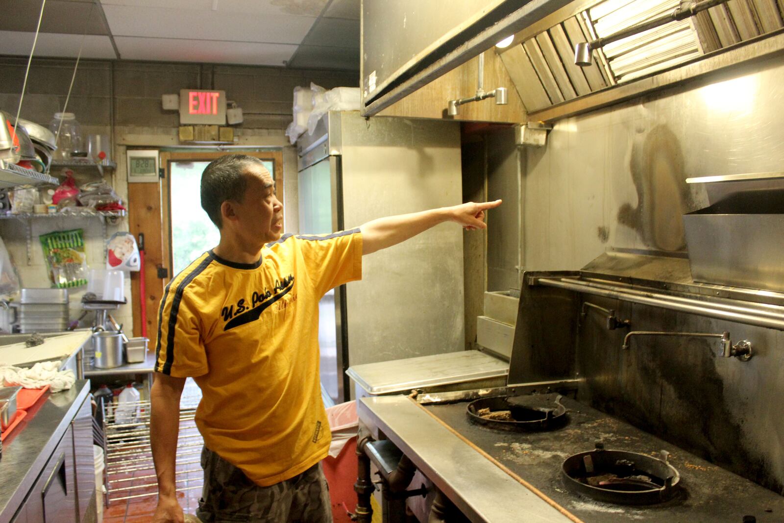 Little Saigon Restaurant,  1718 Woodman Dr. in Kettering, plans to reopen July 25. Bao Thoi, a co-owner,  points to damaged caused by the fire and the fire suppression system.