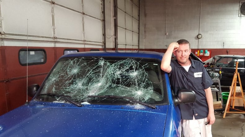 Local comedian Corey Mintz posing on set with a prop car from his film "Find Eddie." Contributed photo.