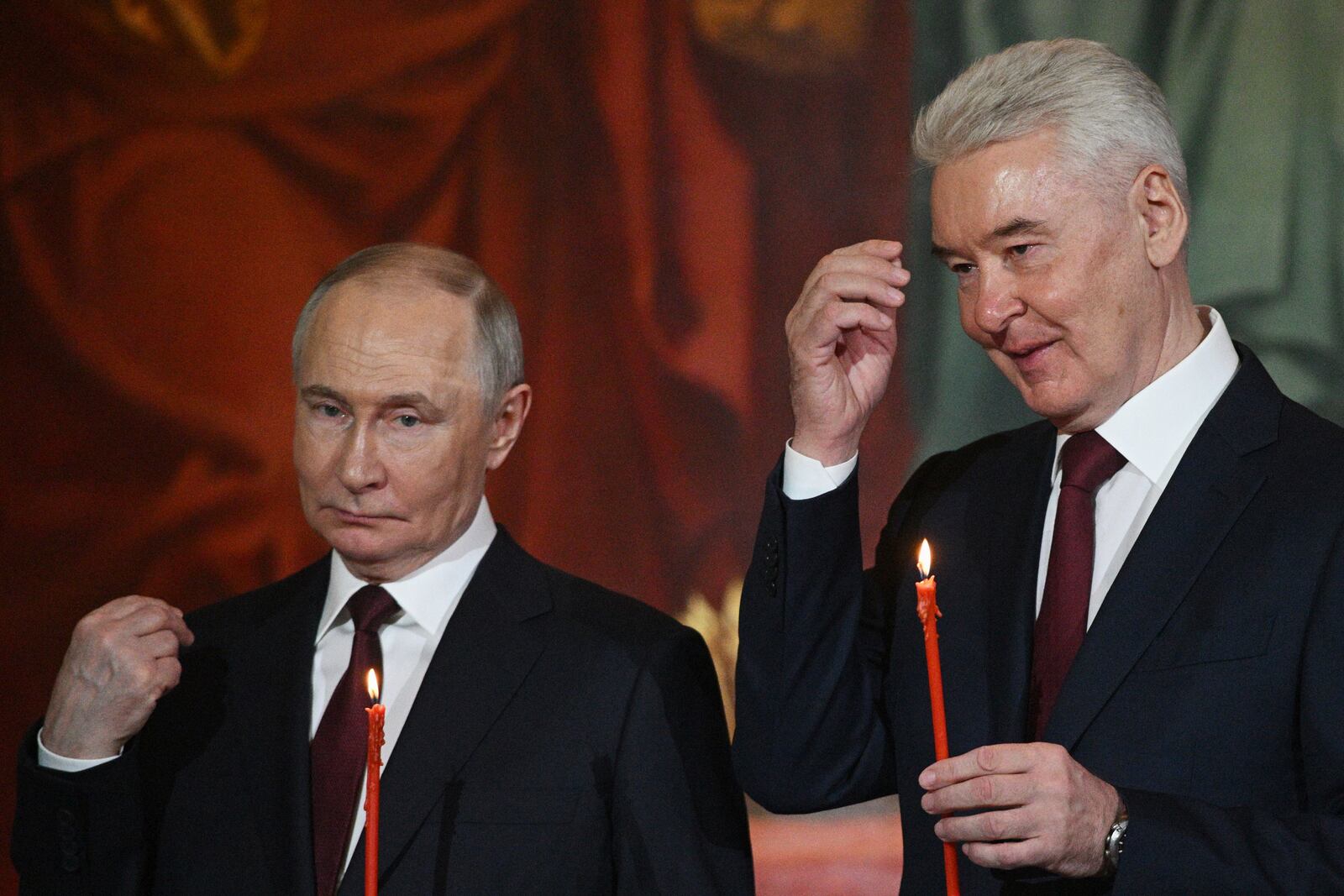 Russian President Vladimir Putin, left, and Moscow Mayor Sergei Sobyanin attend the Orthodox Easter service at Christ the Saviour Cathedral in Moscow, Russia, Saturday, April 19, 2025. (Ramil Sitdikov/Sputnik/Kremlin Pool Photo via AP)