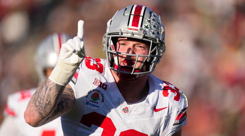 Ohio State defensive end Jack Sawyer (33) celebrates blocking a pass against Oregon during the first half in the quarterfinals of the Rose Bowl College Football Playoff, Wednesday, Jan. 1, 2025, in Pasadena, Calif. (AP Photo/Mark J. Terrill)
