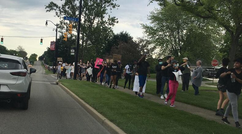 A group called The Solutions Movement protested in Centerville Monday night. More than 500 took part in the event, police said. Communication between the group and police before the protest helped ensure the event went peacefully, both police and organizers said. FILE