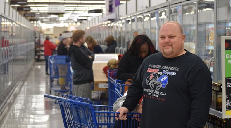 Jason Tharp of Miamisburg was first in line for the 55-inch Element TV with Roku at Meijer Thursday morning.