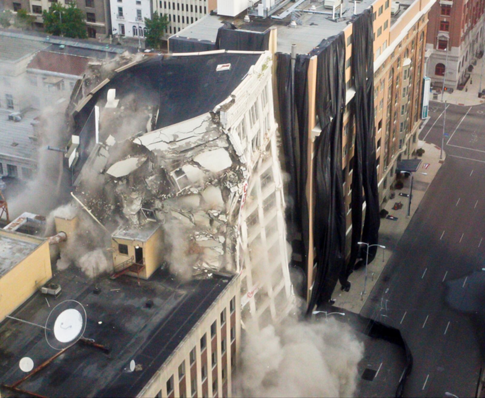 The implosion of the historic, century-old Schwind building occured as planned at 7:15 a.m. Aug. 17, 2013. BARBARA J. PERENIC/STAFF