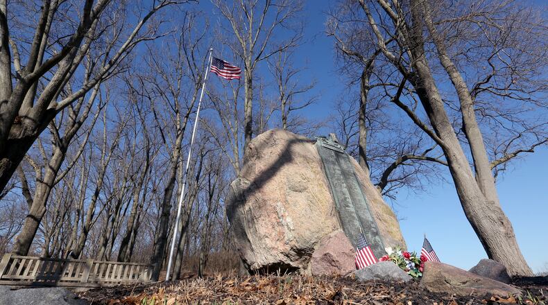 Victory Oak Knoll, a grove of 180 oak trees, was planted in 1921 to commemorate local World War I veterans. The site, within Dayton’s Community Golf Course, is cared for by Kettering Boy Scout Troop 193. Invasive honeysuckle has taken over the grove of trees and the scout troop is raising funds to rent the machinery needed to remove the plant growth. LISA POWELL / STAFF