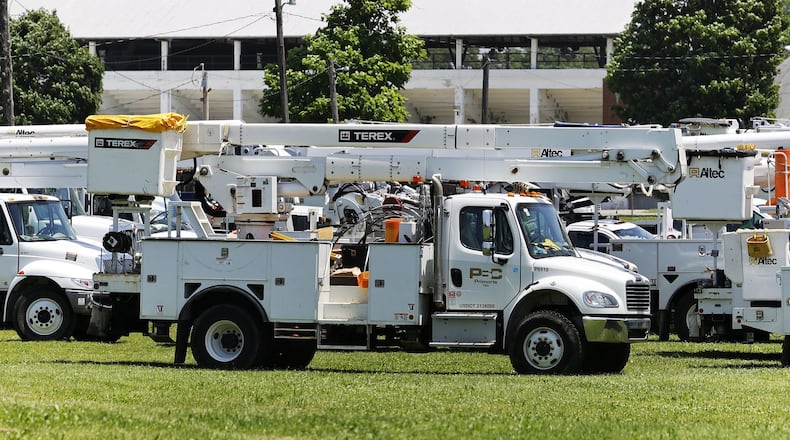 Electric service crews stage to help Duke Energy crews at Butler County Fairgrounds in June 2022 in Hamilton after storms damaged trees and knocked down power lines. NICK GRAHAM/STAFF