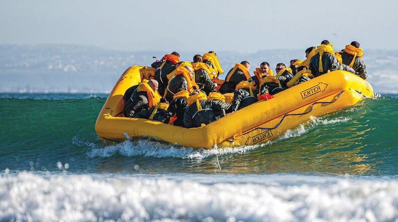 Members of the 445th Airlift Wing Operations Group, Wright-Patterson Air Force Base, brave waters of the Pacific Ocean during water survival training, Feb. 13. More than 160 members from the 445th Operations and Maintenance Groups travelled to Naval Amphibious Base Coronado, San Diego, to perform annual tour. (U.S. Air Force photo/Master Sgt. Patrick O’Reilly)