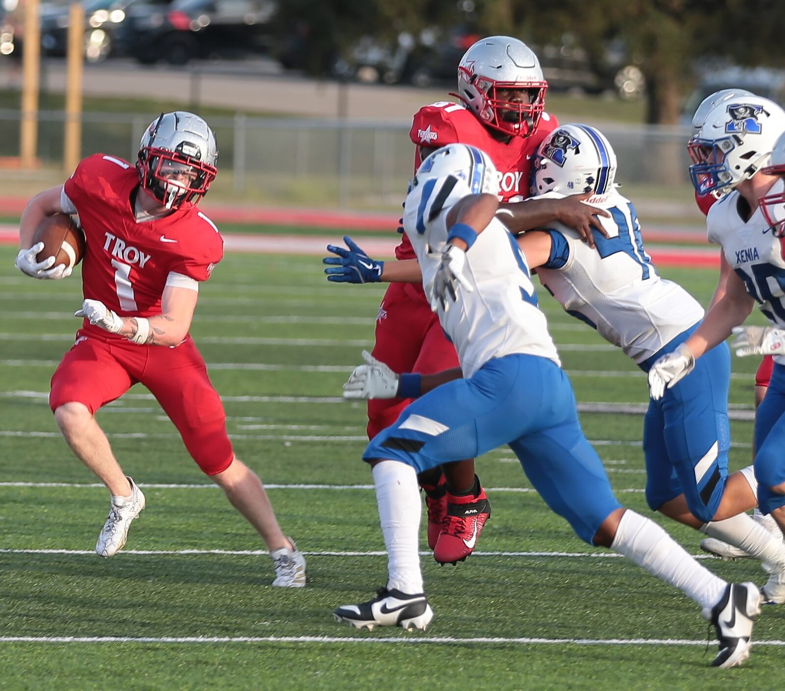 Troy's Aidan Gorman (1) looks to avoid the Xenia defense during a game Friday, Aug. 29, 2025, at Troy Memorial Stadium. Gorman had 52 yards rushing and a 22-yard touchdown catch on the night. Steve Black / Staff