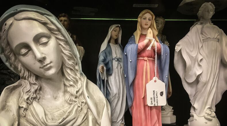 Dayton Church Supply has thousands of religious statues. JIM NOELKER/STAFF