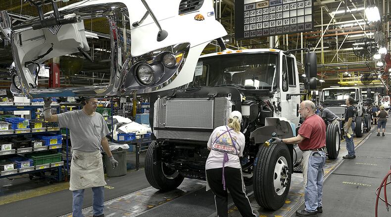 Navistar employees work on the truck assembly line in the Springfield plant on Thursday, Dec. 19. Bill Lackey/Staff