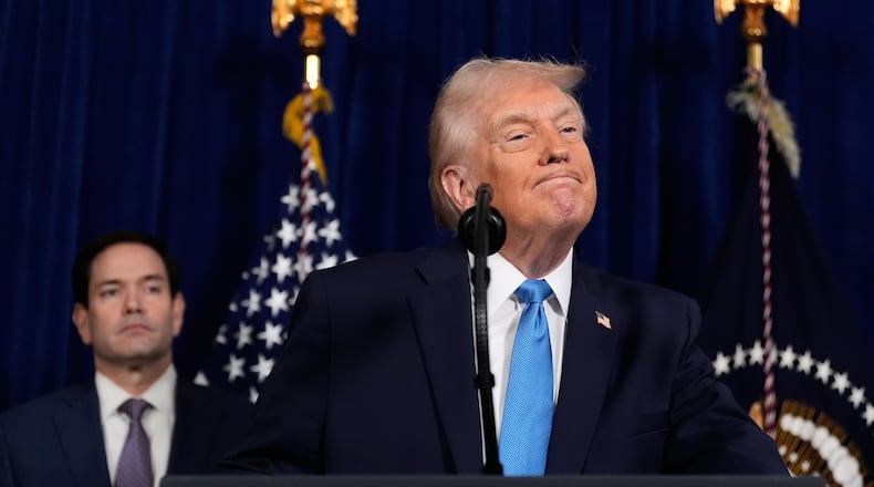 President Donald Trump listens to a question during a news conference at Mar-a-Lago, Saturday, Jan. 3, 2026, in Palm Beach, Fla., as Secretary of State Marco Rubio watches. (AP Photo/Alex Brandon)