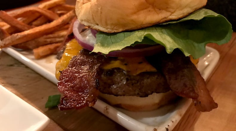 The food at Lock 27 in downtown Dayton. Pictured: Lock 27's Keener Burger served with bacon and an egg added. Photo by Amelia Robinson