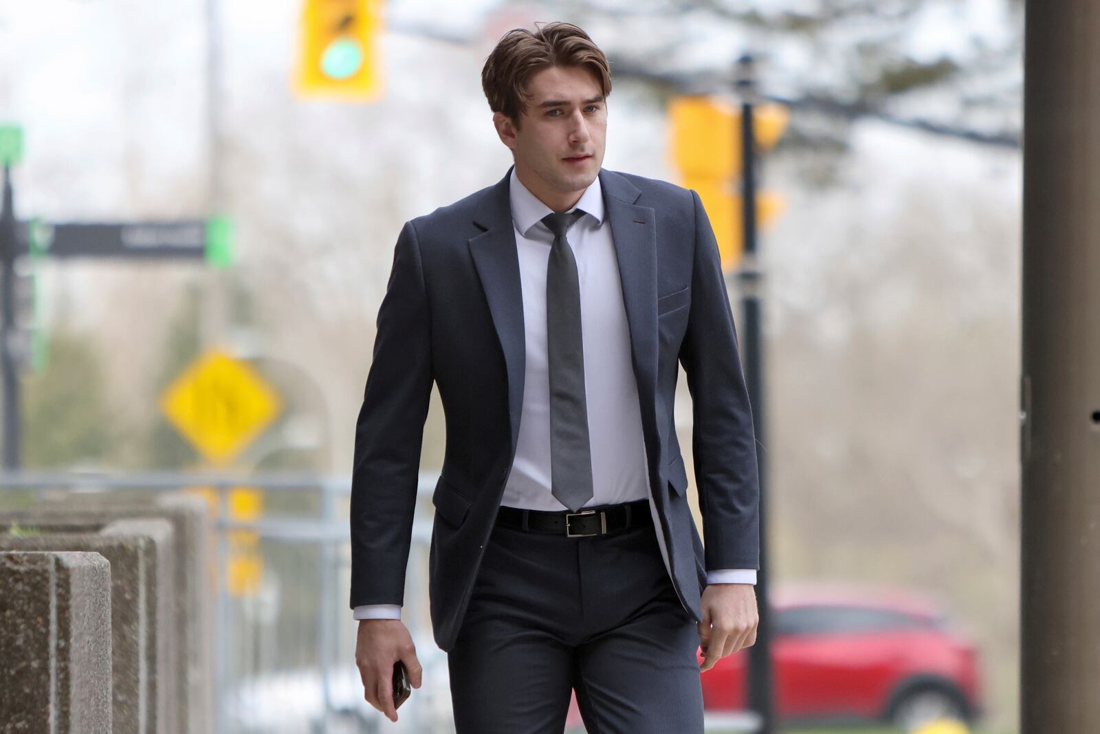 Michael McLeod, one of five members of Canada’s 2018 world junior hockey team charged with sexual assault last year for an incident that allegedly took place in June 2018, arrives at the London Courthouse in London, Ontario, Wednesday, April 23, 2025. (Nicole Osborne/The Canadian Press via AP)