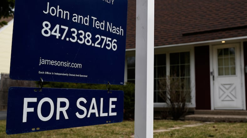 A House For Sale sign is displayed in front of a home in Evanston, Ill.,Wednesday, March 25, 2026. (AP Photo/Nam Y. Huh)