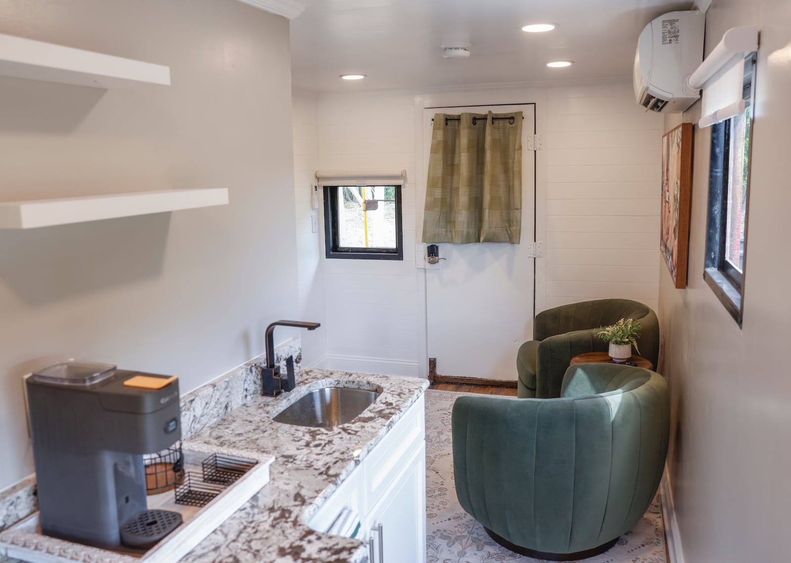 The living room of one of two former cabooses Ray and Karen DeVite turned into Airbnbs on Monday, September 15, 2025, in Xenia. JOSEPH COOKE/STAFF