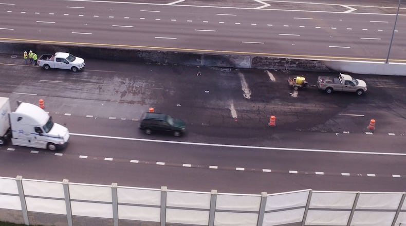 Emergency repair work continued I-75 in Dayton on Monday after a fiery fatal crash closed the highway on Sunday, April 30. A wrong-way driver crashed, head-on, with a gasoline tanker that caught fire. TY GREENLEES / STAFF