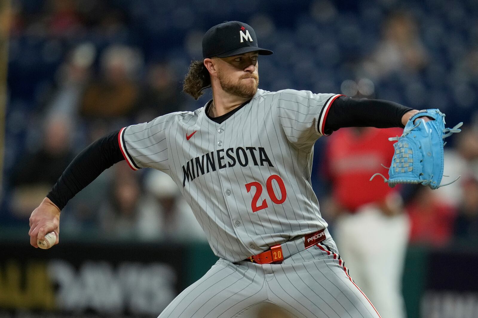 Minnesota Twins' Chris Paddack (20) pitches in the first inning of a baseball game against the Cleveland Guardians in Cleveland, Tuesday, April 29, 2025. (AP Photo/Sue Ogrocki)