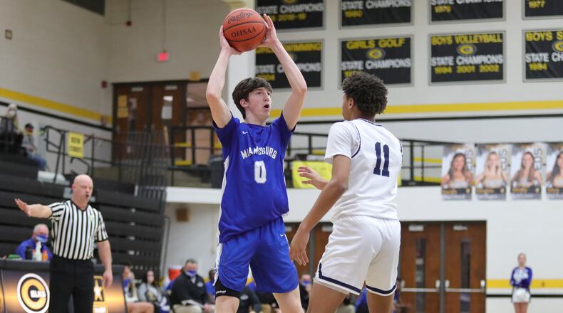 Cutline: Miamisburg High School's Evan Logan is guarded by Springfield's Eddie Muhammad during their game on Friday night at Centerville High School. Logan scored a career-high 31 points as the Vikings advanced to the Division I district finals for the first time in school history. Michael Cooper/CONTRIBUTED