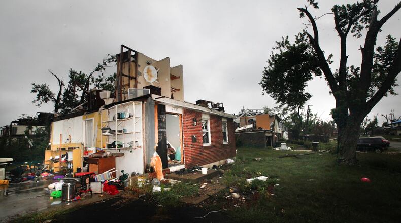 Three months after the Memorial Day tornadoes, little progress has been made on some houses like those in Trotwood on Greenbrook Drive seen Tuesday, Aug. 27, 2019. CHRIS STEWART / STAFF