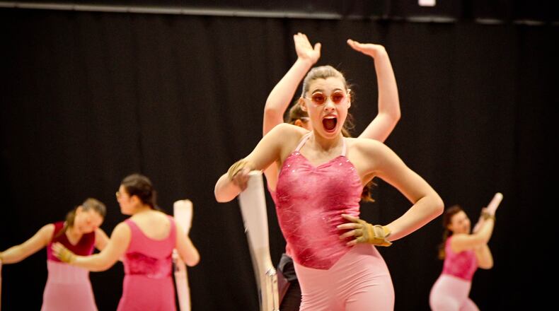 Members of the Avon HS team perform at the WGI Color Guard World Championships at UD Arena in 2020. The 2019 WGI Championships drew 11,000 participants over two weekends, including nearly 300 color guards and 200 percussion ensembles from 40 states and 5 countries. JIM WITMER / STAFF